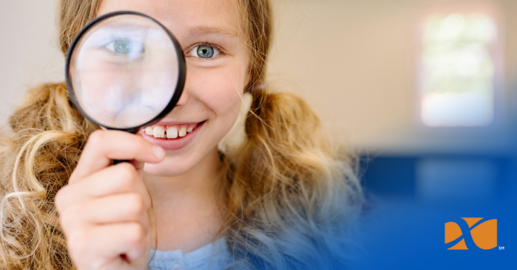 little girl looking at condition of pins for trading