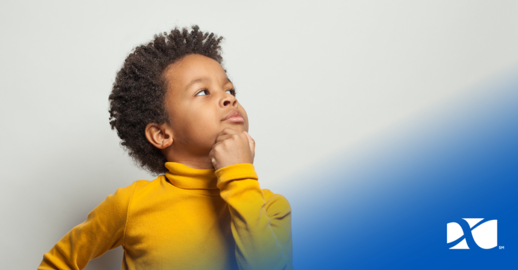 young boy determining rarity of pin for trading